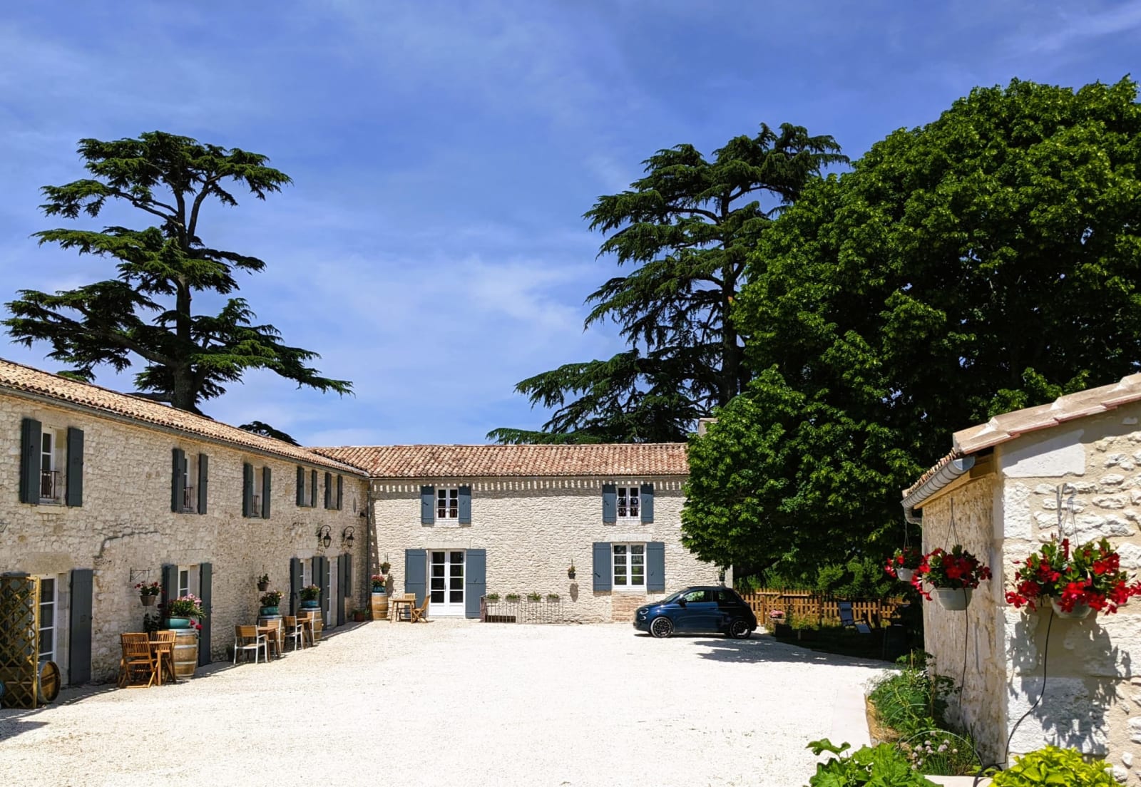 The Old Presbytery courtyard beneath 300-year-old cedar trees